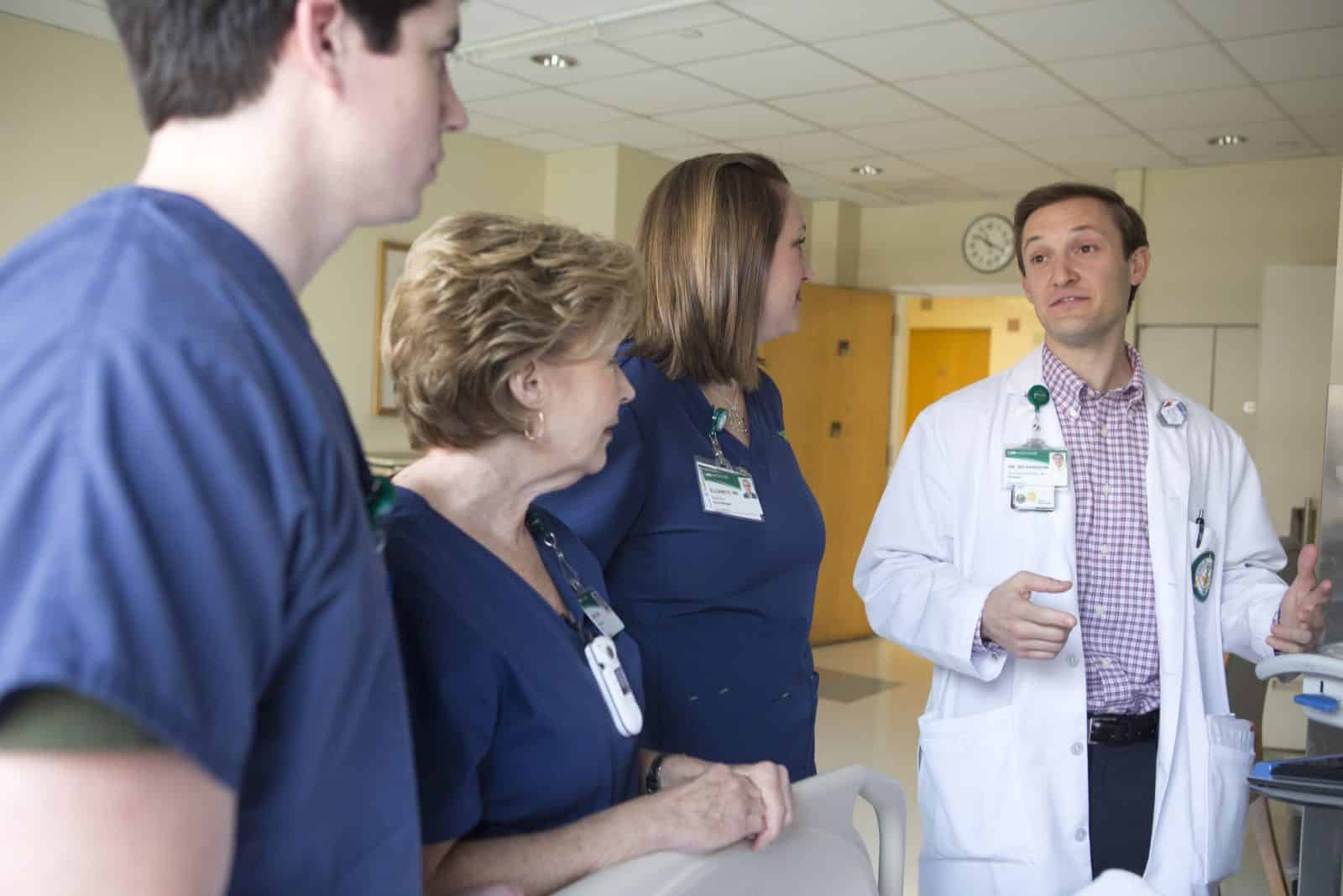 3 Rehabilitation nurses with a resident physician